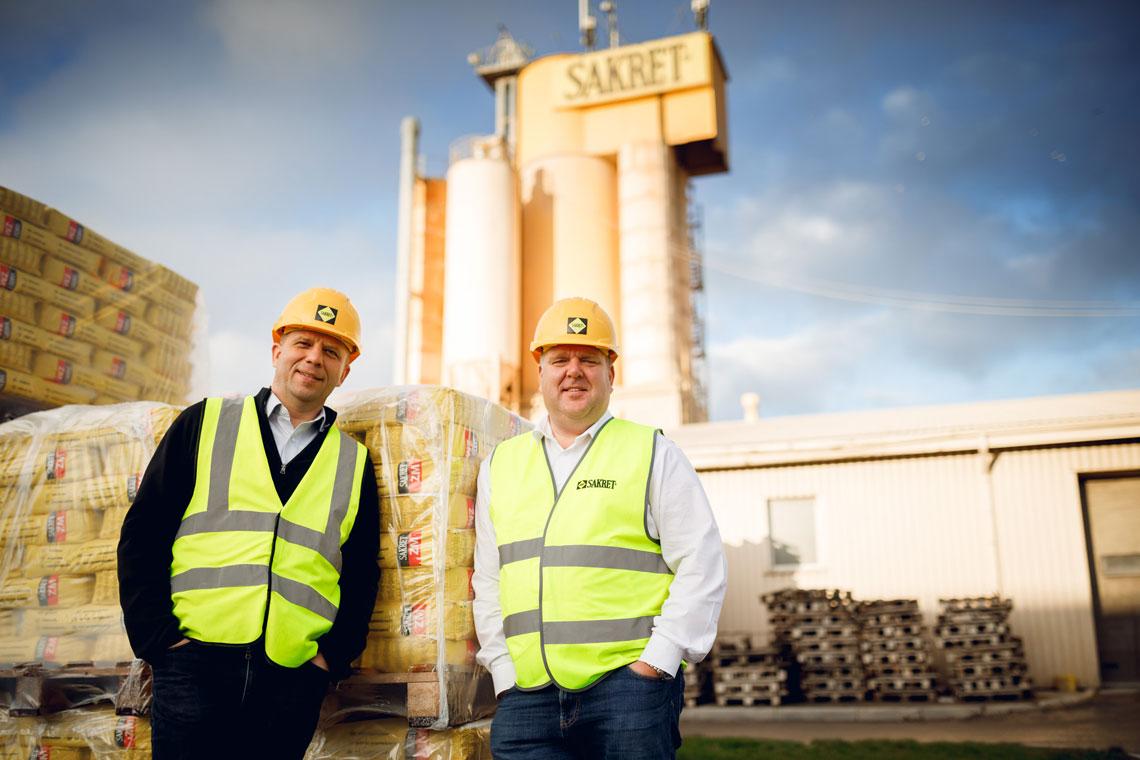 Thumbnail Dr. Andris Vanags and Juris Grinvalds in front of Silo and bags